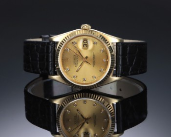 Rolex Datejust. Herreur i 18 kt. guld med brillantbesat skive, ca. 1987