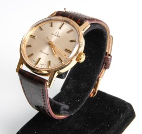 Omega 'Geneva'. Vintage men's watch in 14 kt. gold with silver disc, approx. 1970