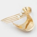 Brooch made of 14 kt gold adorned with three saltwater cultured pearls.