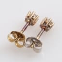 A pair of 14k gold solitaire earrings, 0.20 ct. (2)