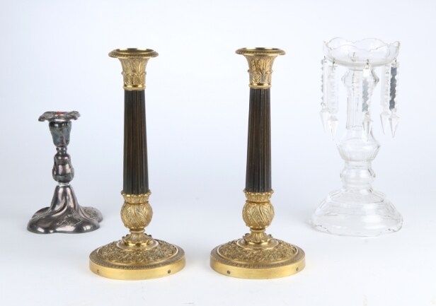 A pair of Empire style candlesticks, a silver candlestick, a glass candlestick (4)