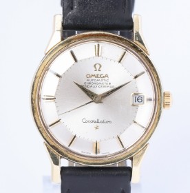 Omega 'Constellation'. Men's steel watch with gold casing, silver pie-pan dial