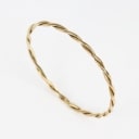 A twisted bangle of 14k gold. Weight 12.5 g.