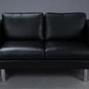 Stouby. Two-person sofa, model Boston, black leather.