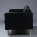 Stouby. Two-person sofa, model Boston, black leather.