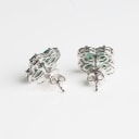 A pair of emerald and diamond ear studs of 18k white gold. (2)