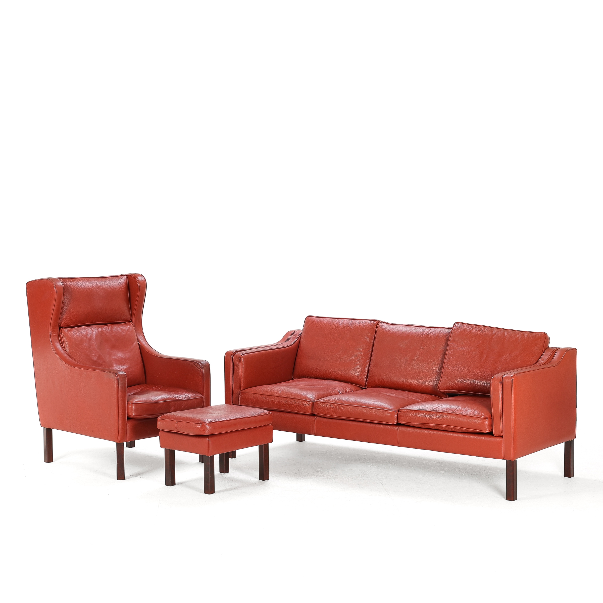 Danish furniture manufacturer: Three-seater sofa and wingback chair with ottoman, red leather (3)