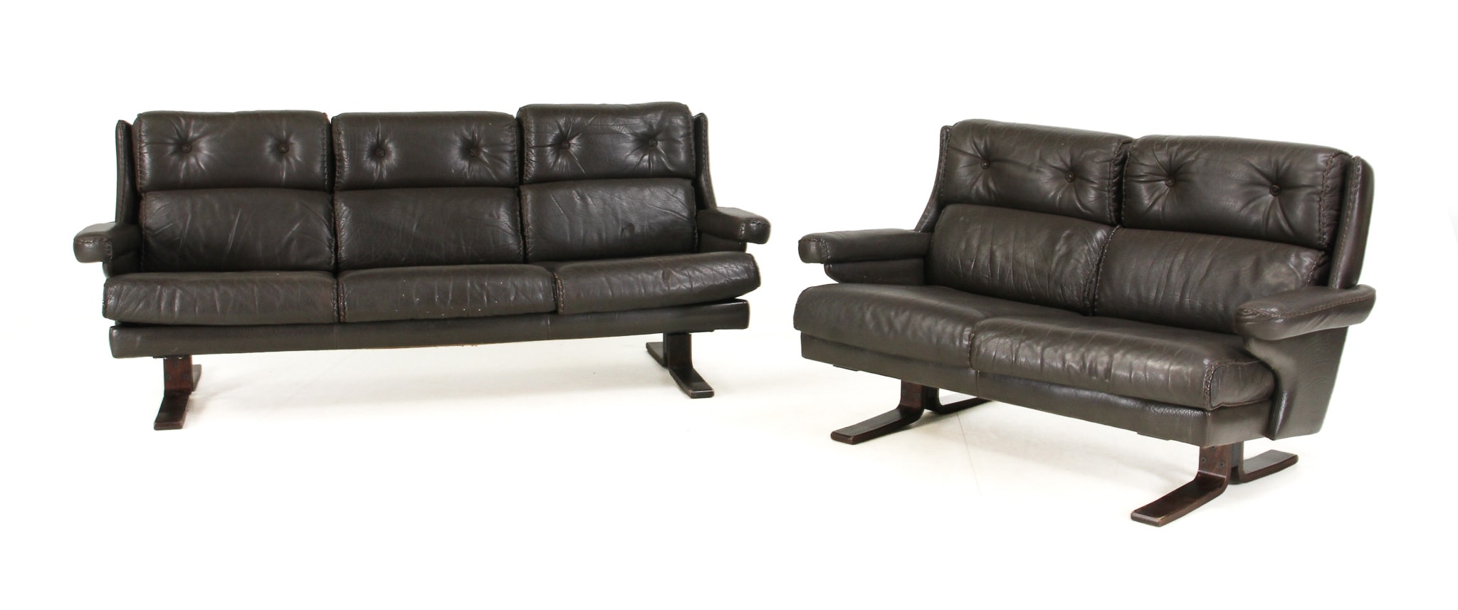 Danish furniture manufacturer. Three- and two-seater sofa/shaker sofas, brown leather, 1970s