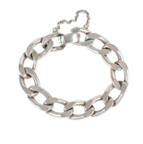 A curb link bracelet of sterling silver.