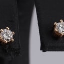 A pair of 14k gold solitaire earrings, 0.20 ct. (2)