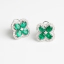 A pair of emerald and diamond ear studs of 18k white gold. (2)