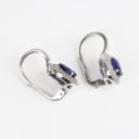 A pair of sapphire and diamond ear pendants of 18k white gold. (2)