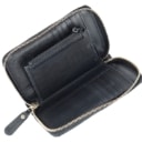 Gucci: A zipped wallet of black microguccissima embossed leather. Model 449423.